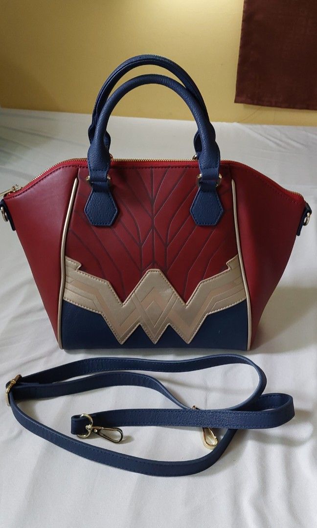 DC Comics Wonder Woman Convertible Handbag Featuring The Iconic Wonder Woman  Logo In Gold With A Patriotic Background