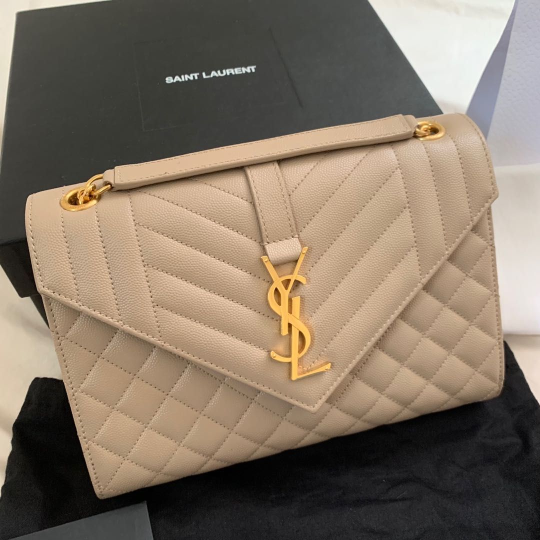 Authentic YSL Saint Laurent Beige Medium Envelope Chain Bag (Category: Luxury Bags & Wallets) located in Taguig. Submitted by thriftygrabs (Listing ID 1235653050, Image 2). Description: Inclusions: Dust bag, Paper bag, Care cards.
