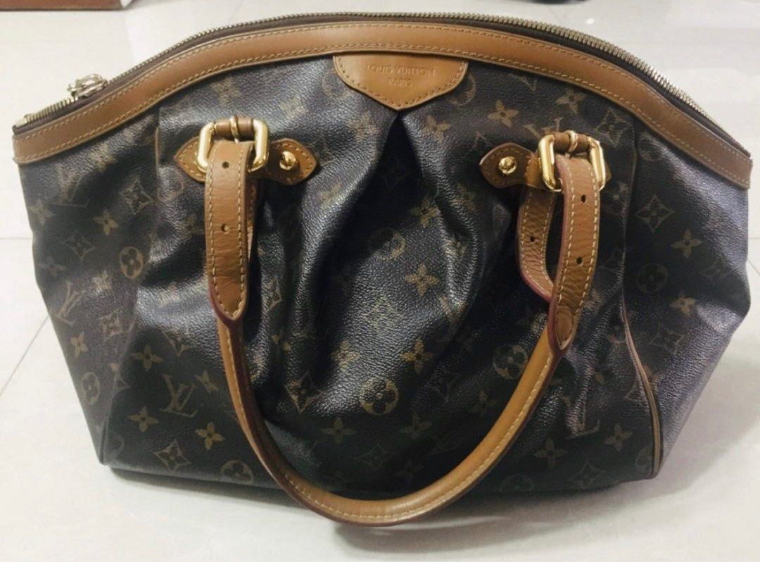 Louis vuitton tivoli (Category: Luxury Bags & Wallets) located in Marikina City. Submitted by missjulieann (Listing ID 1235626914, Image 1). Description: GM size Authentic, bought in SG. No inclusions. Flaws: cracking on rubber lining, open piping to the corner of vanchetta .