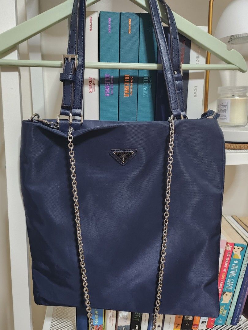 Prada Nylon Tote (Navy Blue) (Category: Luxury Bags & Wallets) located in Manila. Submitted by cloudita (Listing ID 1235653945, Image 2). Description: rfs: my dad has been recently diagnosed with cancer and selling my preloved items to help fund his treatment! ♡ Selling pre-loved topgrade Prada Tote Never used. :) Inclusions are: • Bag • Sling (chain type).