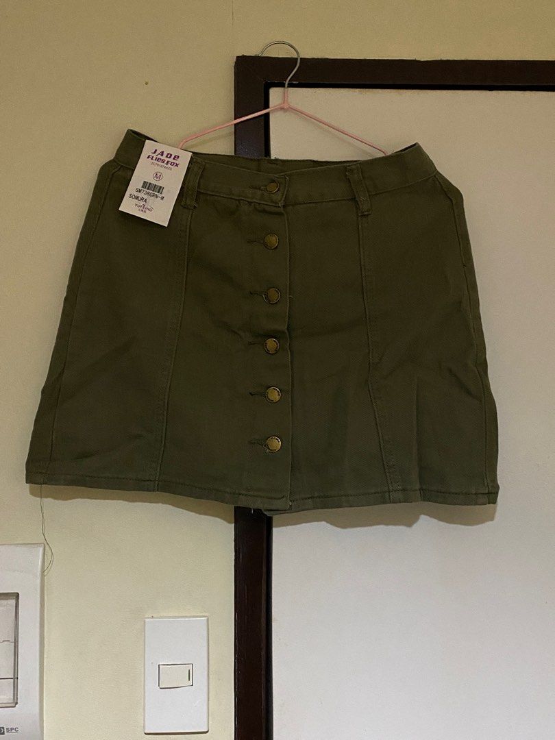Army green button down mini skirt (Category: Skirts) located in Makati City. Submitted by decluttelling (Listing ID 1235839118, Image 1). Description: 25-27 inches .