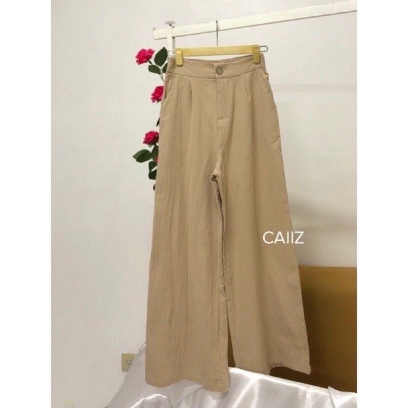 Beige Wide Leg Pants (Category: Other Bottoms) located in Quezon City. Submitted by patbrandeditems (Listing ID 1235836095, Image 1). Description: Breathable Linen fabric Garterized back With pockets Has slight himulmul at the botton .