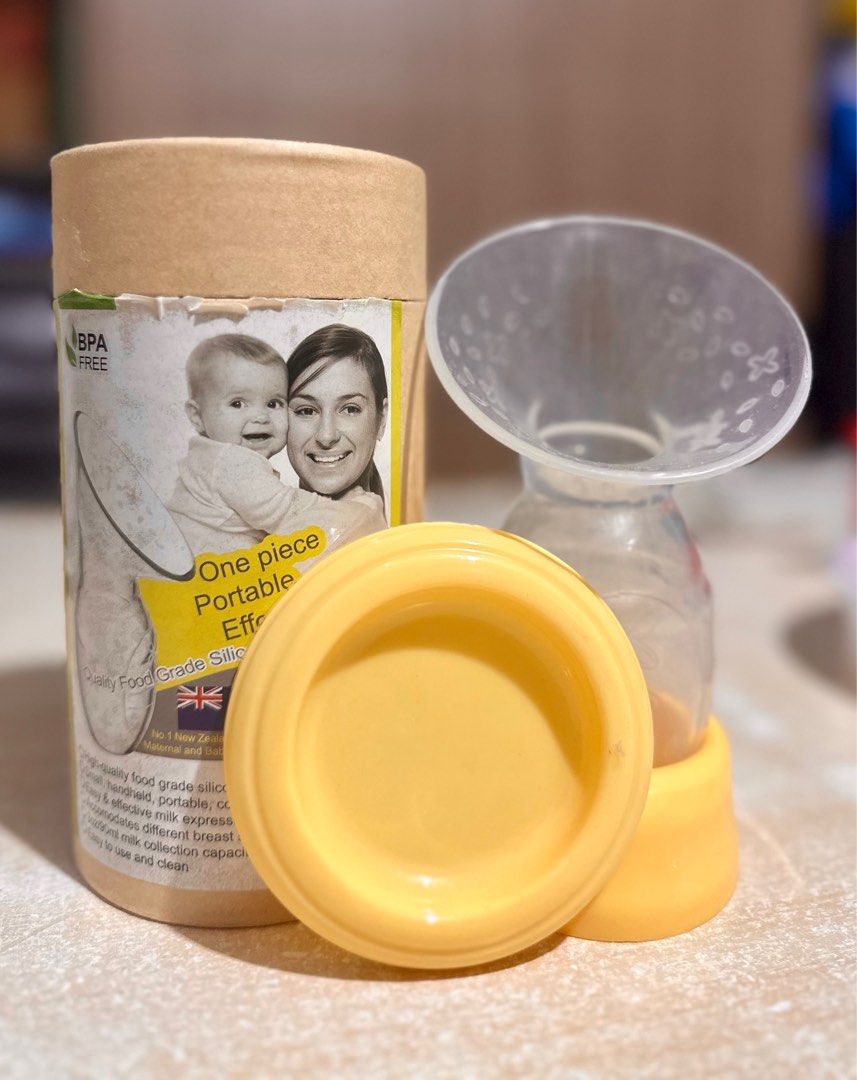 Haakaa Silicone Breast Pump with stand and cover on Carousell