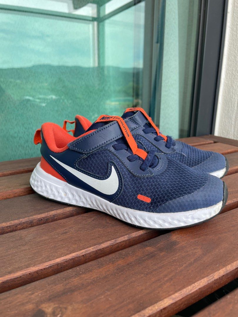 Kids blue and hot sale orange nike revolution