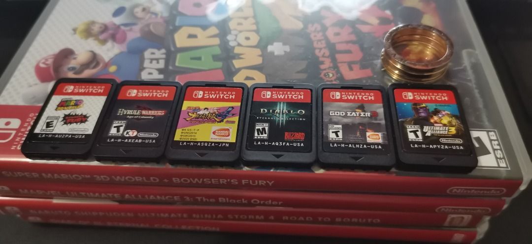 Nintendo switch v2 (Category: Nintendo) located in Pasay City. Submitted by venomivy (Listing ID 1235853950, Image 3). Description: Nintendo Switch V2 10k 128gb mmc Temp glass installed With box and complete accessories Digital games included Nba 2k22 Demon slayer with all dlc character Pack. Add ons: take all for 3500 Switch joycons red and blue with grip and straps. Skull & co tempered glass 1 pc 2 pcs skull & co carrying case (large black & de