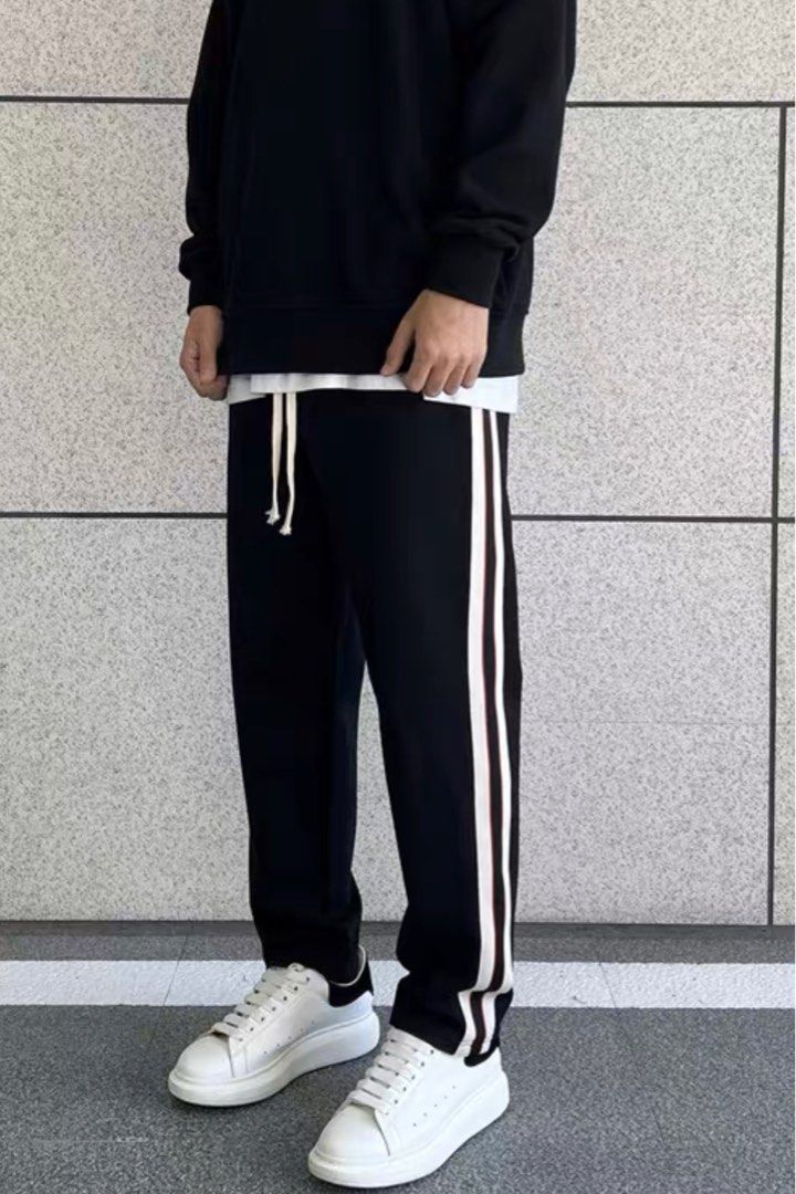 Men's black track top pants with white stripe