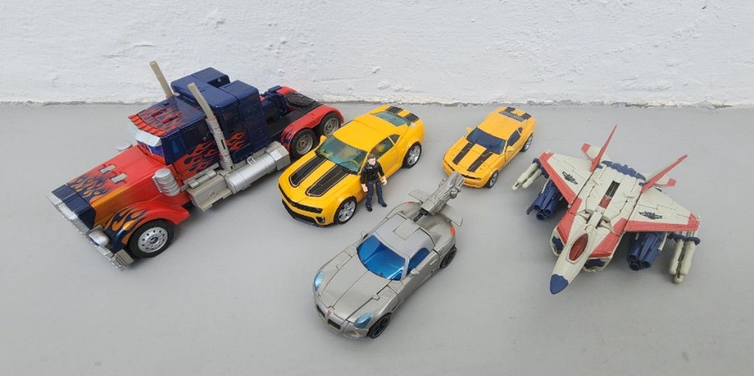 Transformers (Category: Toy Figures) located in Singapore. Submitted by ms.capybara (Listing ID 1235817889, Image 4). Description: Clearing vintage Transformers from different Toylines. Please see below for pricing. Takara Tomy (TT) and Hasbro. please DM to confirm the correct version. Since they are loose. open to negotiation. below market price NOT KO Transformers Movie 2007: Optimus Prime (Leader Class: Premium Vers) Starscream (G1 Deco) Jazz 