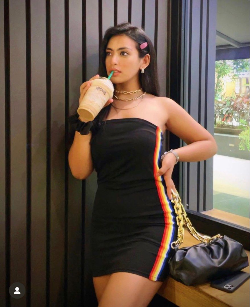Black dress shop with rainbow stripe
