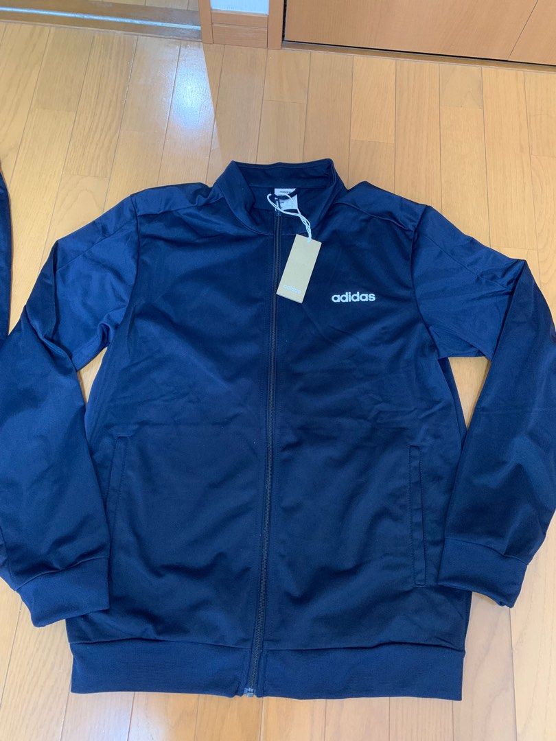 ADIDAS Men’sTrack Suit (Authentic) (Category: Sets & Coordinates) located in Manila. Submitted by arisofcalico (Listing ID 1236079359, Image 2). Description: Authentic Adidas Men’s Track Suit Color: LegInk/Navy Blue Size XXL, Asian Size Good, quality fabric Selling as set, imported items bought from Japan, given as a present Unstripe Model (FRW21) with rubberized, embossed “ADIDAS” logo Jacket: Chest widh: 22 inches Length: 28 inches Pants: Waist