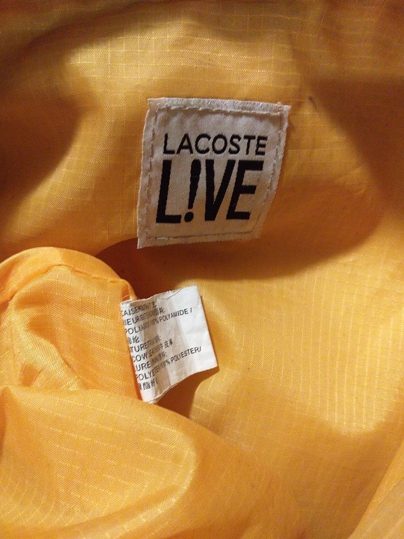 Authentic Lacoste L!VE Sling Bag (Category: Sling Bags) located in Marilao. Submitted by MusicAndThings (Listing ID 1236170722, Image 2). Description: Mustard Yellow Color Unisex Nylon Material.