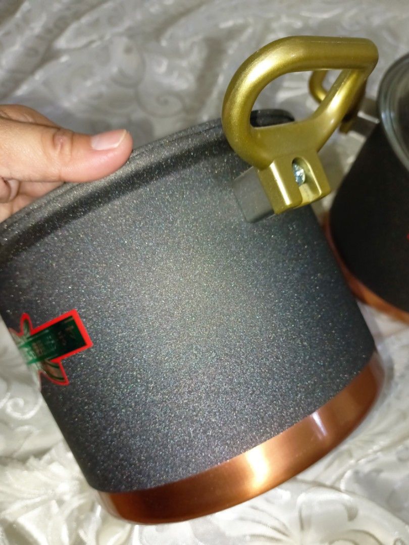 Copper Granite Cookware (Category: Cookware & Accessories) located in San Jose del Monte. Submitted by eivon29 (Listing ID 1236206749, Image 3). Description: Copper Granite Cookware 2pc.set with Glass Neorex lid. The pots with aesthetic and durable granite body are completed with stylish and brass handles. The heat is distributed evenly and the meals you cook are much more delicious. It can be used in all kinds of stoves (Electricity, gas, cerami