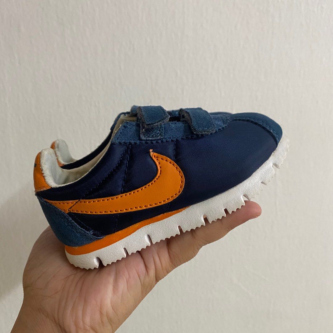 Navy blue and yellow nike cortez online