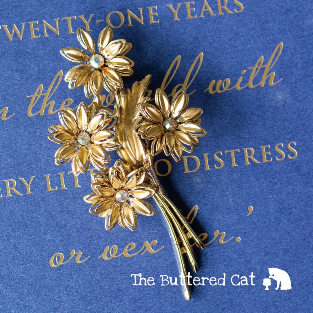 Gold tone brooch sale