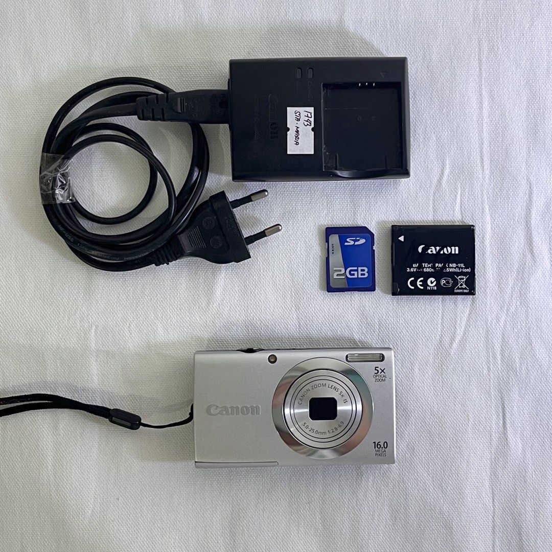 Canon PowerShot A2500 HD (16mp) | Digital Camera | Digicam (Category: Cameras) located in Manila. Submitted by _gudo18 (Listing ID 1236400260, Image 1). Description: Canon PowerShot A2500 for sale only! (Looks brand-new 🫶🏻) Please read before inquiring 💗 -Ready to use -No issues -16mp -Can take picture and video (Lakas maka 90's! 🥹) -10/10 Body cosmetics (Almost looks new) -Has date stamp and different filters Inclusions: -Unit -Original NB-1