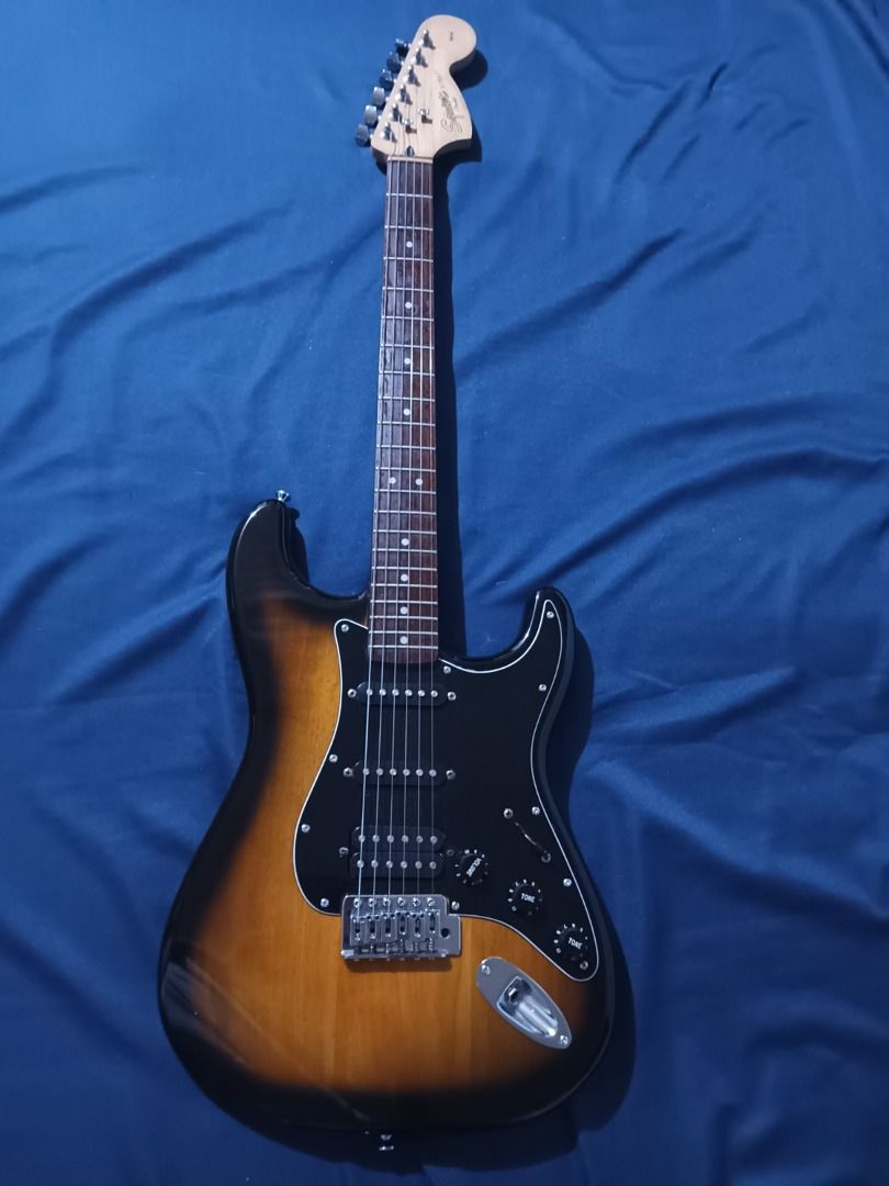 fender squier affinity stratocaster (Category: Musical Instruments) located in Dasmarinas. Submitted by raf.raf1 (Listing ID 1236377306, Image 2). Description: for sale fender squier affinity poplar body gloss polyurethane sunburst paint maple neck indian laurel fretboard 21 medium jumbo fret big headstock standard diecast tuners hard tail bridge HSS ceramic pick ups 5 way pick up switch 1 volume knob 2 tone knobs ALL STOCK low action thin neck m