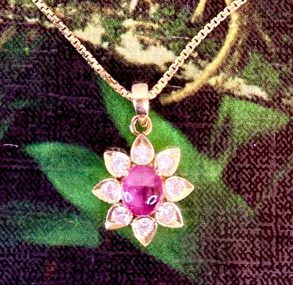 Gold pendant with red on sale stone