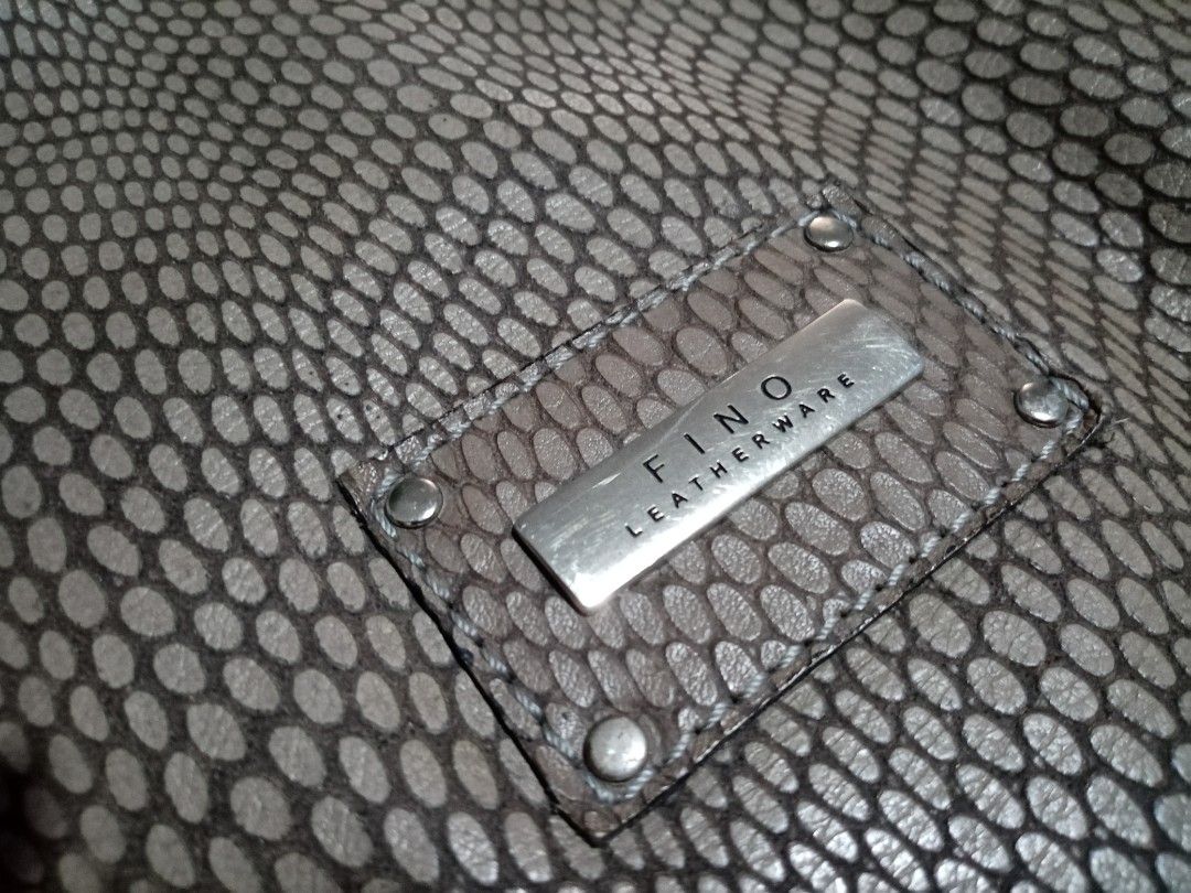 Fino Leatherware Tote Bag (Category: Tote Bags) located in Cebu City. Submitted by maksipreloveditems (Listing ID 1236432809, Image 3). Description: Fino Leatherware Tote Bag Color: Grey * Item is in Cebu City. PLEASE READ: Photos posted are FINAL. NO "When Worn Photos" request please. Flaws were mentioned in the description and shown in the pictures posted. Dimensions: Shoulder: Arms: Length: 9.50 to 15 inches Width: 5.50 inches Height: 10 inche