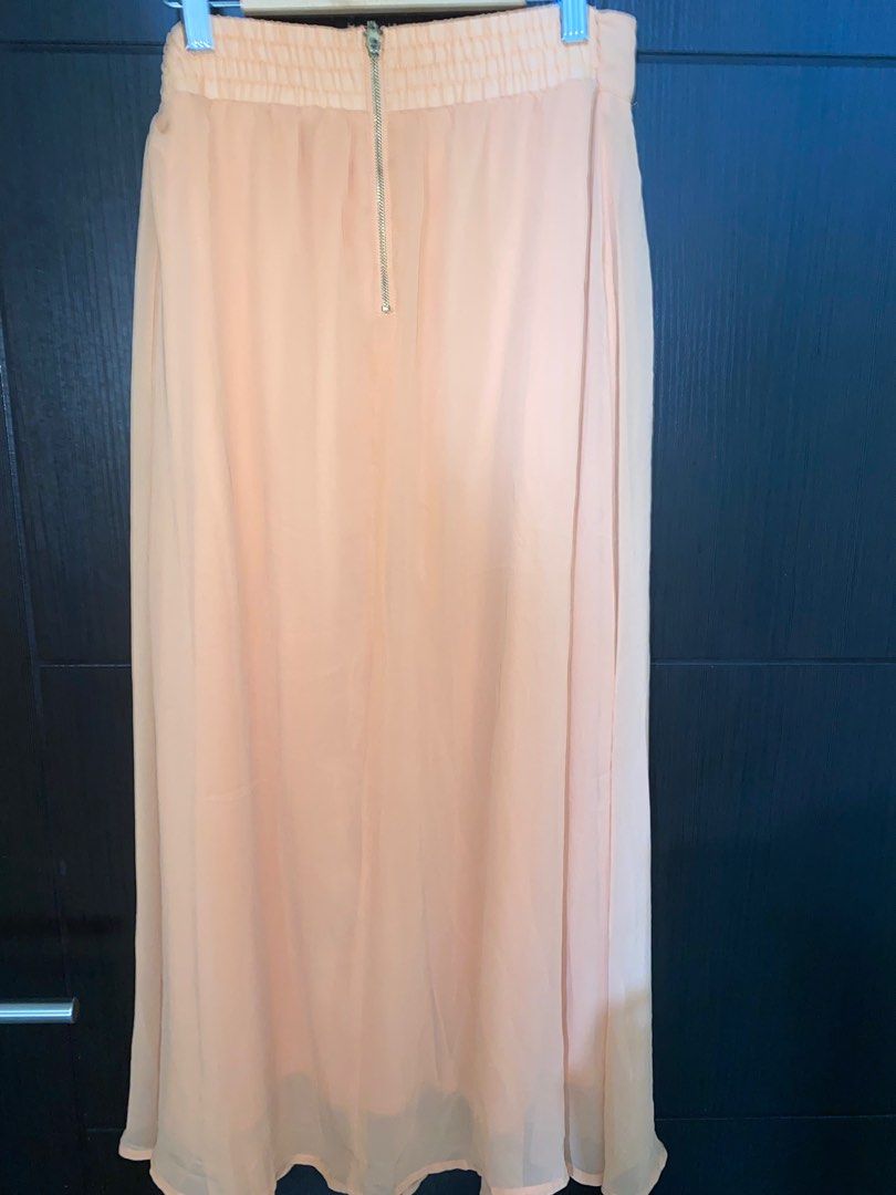 Forever 21 Long Skirt (Pinkish Peach) (Category: Skirts) located in Cavite. Submitted by mocksteals (Listing ID 1236483021, Image 2). Description: - Negotiable - Original - Not thrifted - No flaws Message me for more inquiries..