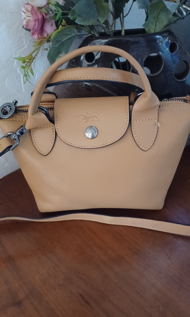 Longchamp mini sling bag on Carousell