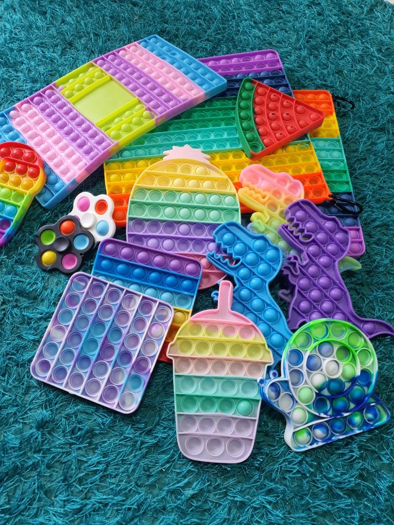Pop-it Fidget toys (Category: Kids Toys) located in Singapore. Submitted by rainingbabies (Listing ID 1236451623, Image 3). Description: Take all 15 pieces for $18 only. 2 big square ones. 1 big rectangle. 1 ice cream. 1 Watermelon. 1 snail. 3 dinosaurs. 1 pineapple. 2 small squares. 2 fidget spinner pop-it. 1 among us. Self collect at S732784 or Admiralty Mrt Station..