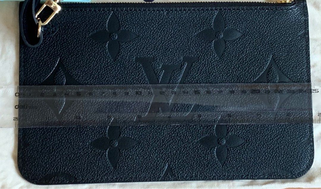 LV Neverfull MM pouch (Category: Luxury Bags & Wallets) located in Malolos. Submitted by flapnbloom.ph (Listing ID 1240512534, Image 3). Description: LV pouch in Empreinte leather, Black, bought it brand new and carried once only, with dustbag Dimension L: 25cm x H:15.5cm Removable strap is long enough to convert it to shoulder bag. MOP: Bank transfer/GCash Pm for inquiries.