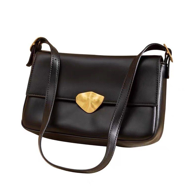 Vintage shoulder bag (in black and brown) on Carousell