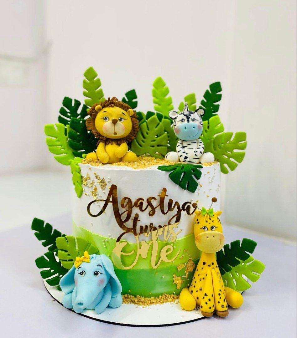 Boy with Cake and Zoo Animals Toppers | Delcie's Desserts and Cakes