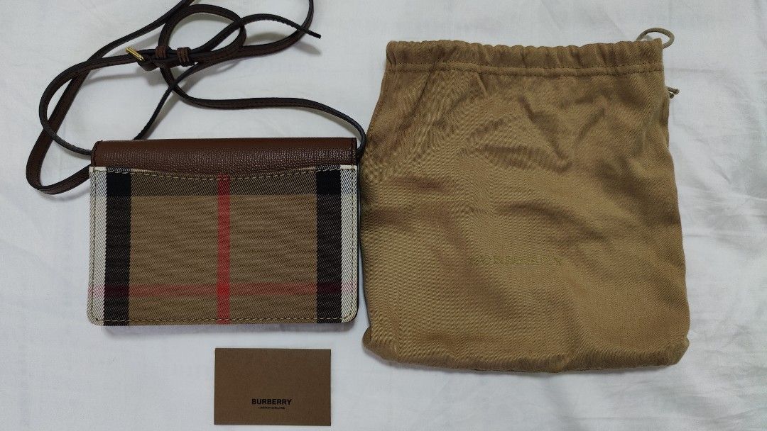 Burberry Crossbody Tan brown sling bag (Category: Bags & Wallets) located in Singapore. Submitted by 21cents (Listing ID 1242395301, Image 3). Description: Authentic, got a friend to buy from London Used twice but realised it's too small for me No defects nor stains, good as new No box Only dust bag and original booklet is available Meetups at Raffles place No trades . 19* height 13* width 4cm, shoulder strap length 55cm, shoulder strap length 12