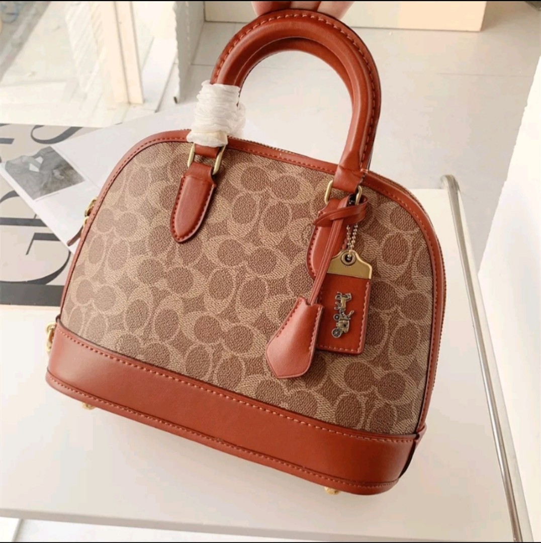 COACH Revel Bag In Signature Canvas in Brown