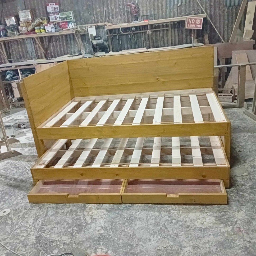 DAY BED WITH PULL OUT BED AND DRAWER (Category: Bed Frames & Mattresses) located in General Trias. Submitted by jameswoodlike (Listing ID 1242515226, Image 1). Description: made to order imus cavite all sizes available other designs available made of Canadian pine solid wood.