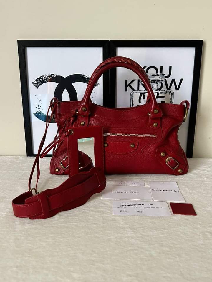 Balenciaga First Classic Bag (Category: Luxury Bags & Wallets) located in Manila. Submitted by bagislifeshop (Listing ID 1242585938, Image 1). Description: ☑️Available in Manila ✅Condition: 8.8/10 ✅Material: Goatskin Leather ✅Color: Red in Antique GHW ✅Inclusion: Cards, mirror, strap and swatch leather.
