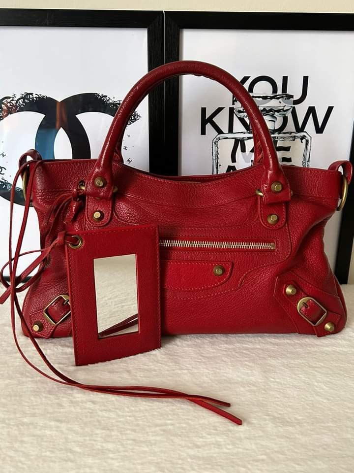 Balenciaga First Classic Bag (Category: Luxury Bags & Wallets) located in Manila. Submitted by bagislifeshop (Listing ID 1242585938, Image 2). Description: ☑️Available in Manila ✅Condition: 8.8/10 ✅Material: Goatskin Leather ✅Color: Red in Antique GHW ✅Inclusion: Cards, mirror, strap and swatch leather.