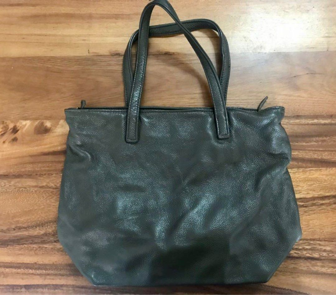 REPRICED PRAVI Samara 2in1 bag (Category: Shoulder Bags) located in Quezon City. Submitted by turak2020plus1 (Listing ID 1242553615, Image 1). Description: PRAVI Samara bag Shoulder to crossbody bag Olive grey color Authentic leather, ziptop, cloth lining, 3 interior pockets (1 zippered), detachable and adjustable strap Height: 13in, Width (base): 12in, Width (top): 17in, Depth: 5.5in, Handle drop: 9in Slightly used, in good condition..