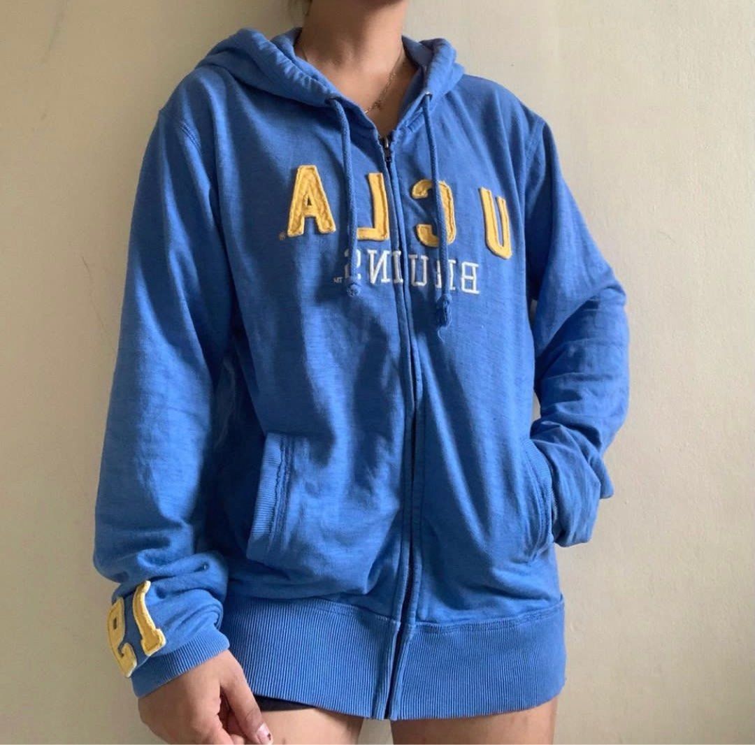 UCLA HOODIE JACKET (Category: Coats, Jackets and Outerwear) located in Muntinlupa City. Submitted by hun_thrift (Listing ID 1242604553, Image 3). Description: H30 Colosseum athletics ucla hoodie zip up jacket L on Tag • best fit small to semi med Length 24 Almost bnew! 100/100 good condition Excellent fabric!! ganda so much!! for keeeeeps 🫶🏻🥹 .