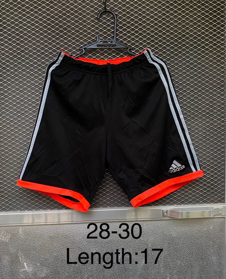 black adidas shorts with orange stripes