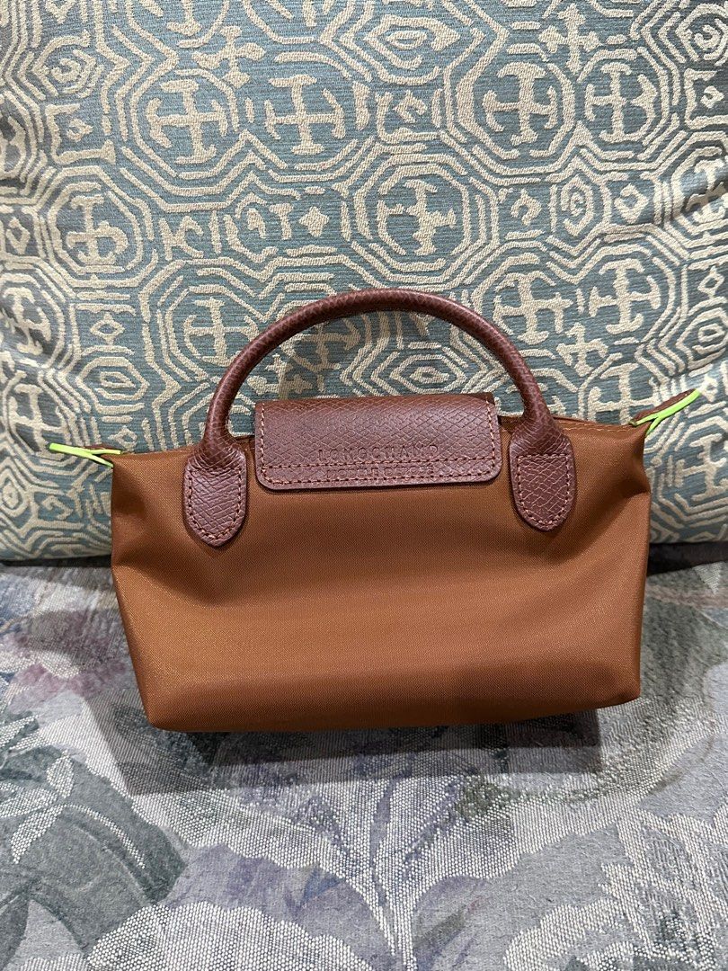 Authentic Longchamp Le pliage mini pouch eith handle -Cognac (Category: Luxury Bags & Wallets) located in Manila. Submitted by mybeadshop (Listing ID 1242828062, Image 2). Description: .