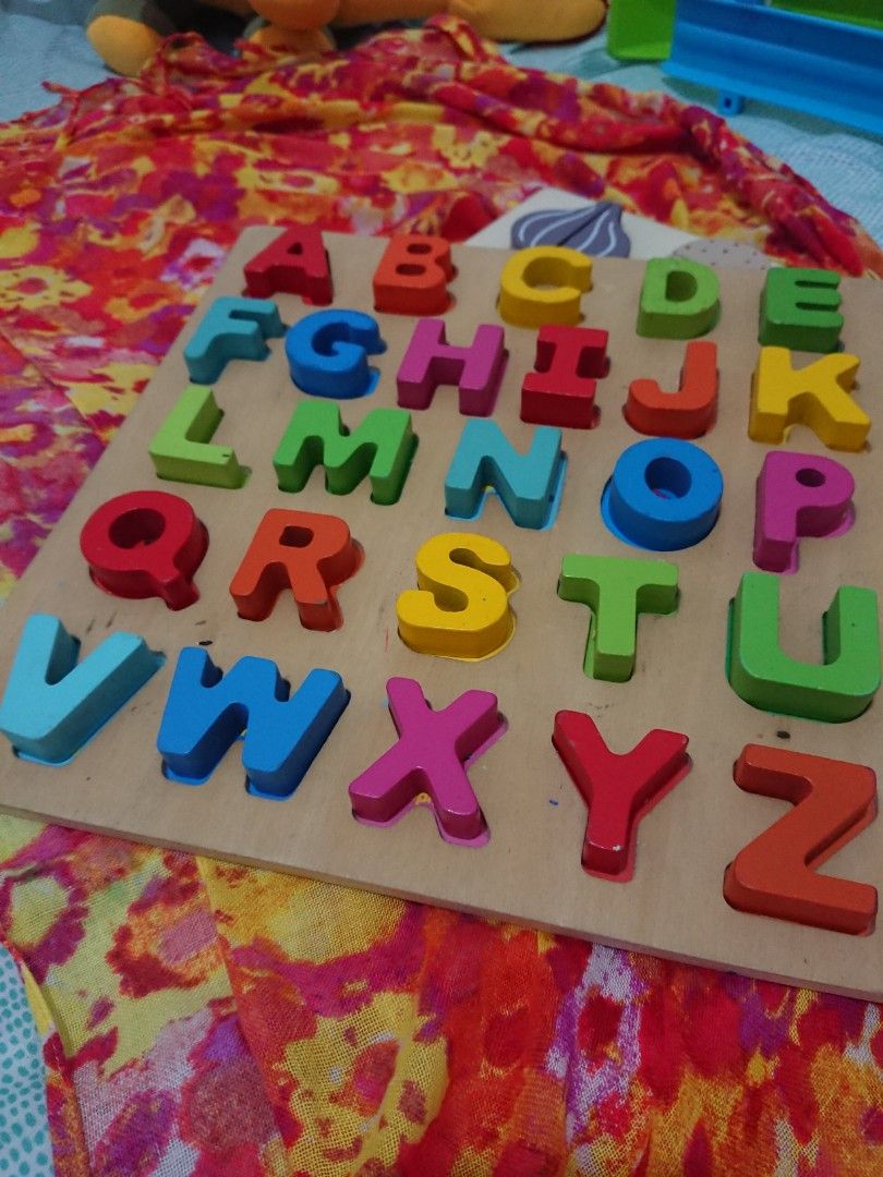 Generate Learning Fun with chunky wooden alphabet shapes puzzle