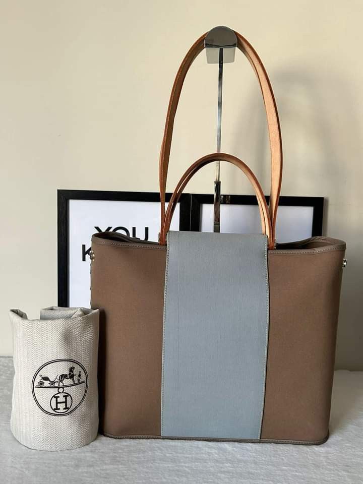 Hermes Cabag Elan PM Bag (Category: Luxury Bags & Wallets) located in Manila. Submitted by bagislifeshop (Listing ID 1242898534, Image 1). Description: ☑️Available in Pampanga ✅Condition: 8.8/10 ✅Stamp: Q square (2013) ✅Material: Canvas and vache natural hunter leather ✅Color: Taupe and baby blue in PHW ✅Size: 12.5’ x 10’ x 4.5’ inches ✅Inclusion: Dustbag.