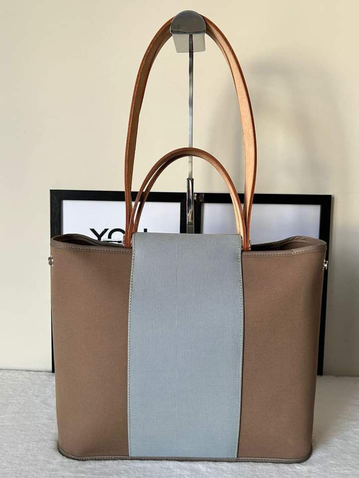 Hermes Cabag Elan PM Bag (Category: Luxury Bags & Wallets) located in Manila. Submitted by bagislifeshop (Listing ID 1242898534, Image 2). Description: ☑️Available in Pampanga ✅Condition: 8.8/10 ✅Stamp: Q square (2013) ✅Material: Canvas and vache natural hunter leather ✅Color: Taupe and baby blue in PHW ✅Size: 12.5’ x 10’ x 4.5’ inches ✅Inclusion: Dustbag.