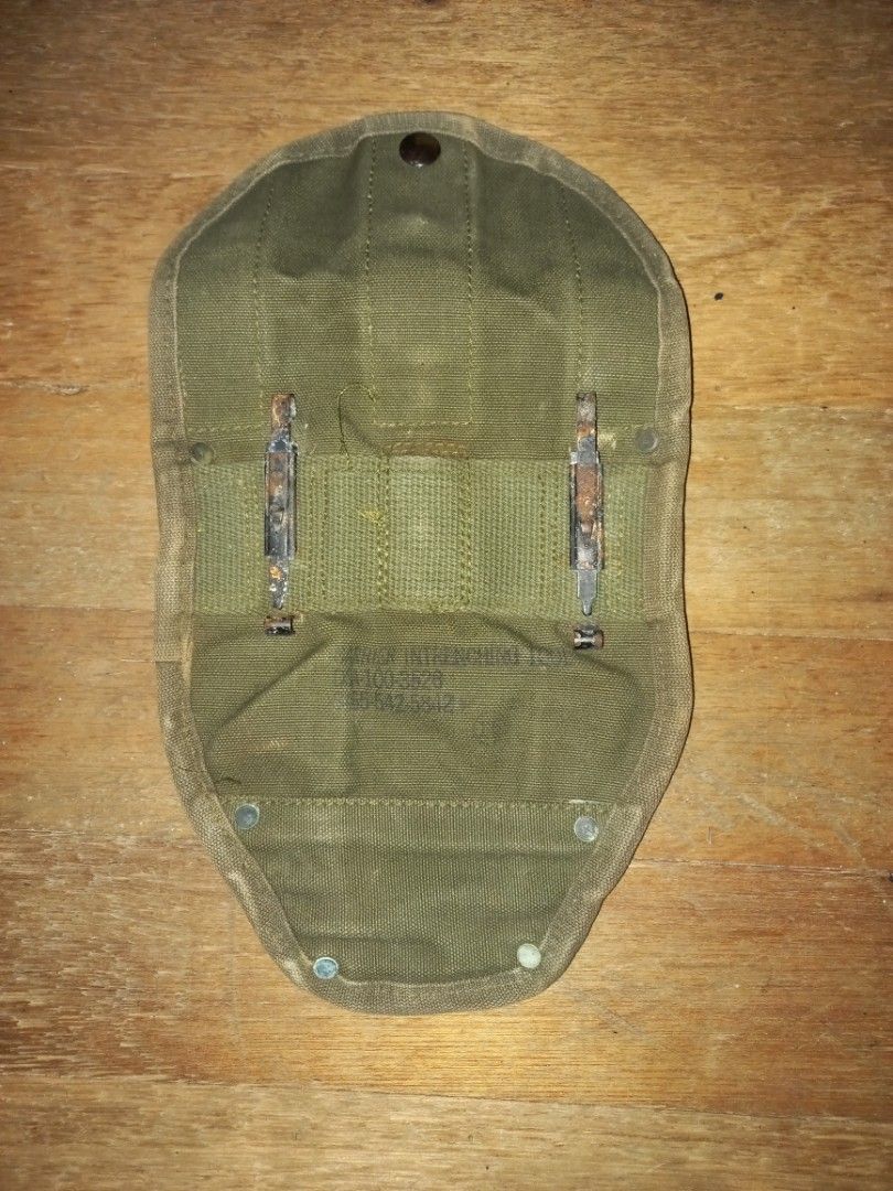 M 56 E-Tool Cover (Category: Home Improvement Tools & Accessories) located in Pasig City. Submitted by ma-rt (Listing ID 1242782997, Image 2). Description: Original Vietnam Era US GI M1956 Entrenching Tool or Shovel Canvas Carrier Cover. These covers were used to carry the M43 and M51 (with pick) Entrenching tools. These covers also have a set of M1910 belt hook grommets on the front as an additional attachment point for the MY bayonet. Two Alice