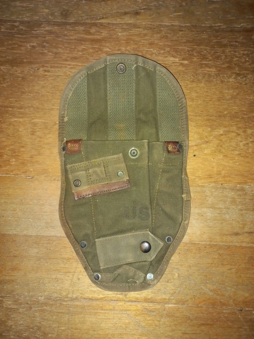 M 56 E-Tool Cover (Category: Home Improvement Tools & Accessories) located in Pasig City. Submitted by ma-rt (Listing ID 1242782997, Image 1). Description: Original Vietnam Era US GI M1956 Entrenching Tool or Shovel Canvas Carrier Cover. These covers were used to carry the M43 and M51 (with pick) Entrenching tools. These covers also have a set of M1910 belt hook grommets on the front as an additional attachment point for the MY bayonet. Two Alice