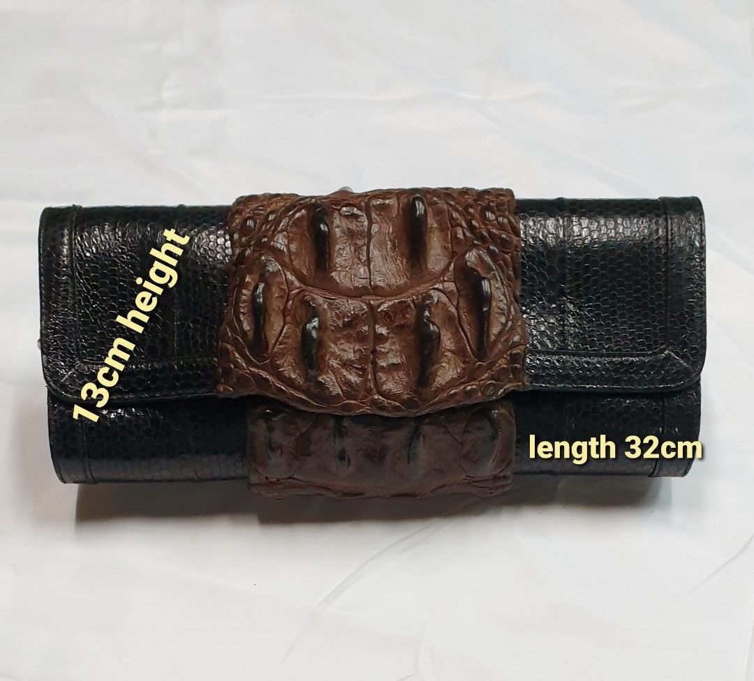 Crocodile with snake clutch (Category: Luxury Bags & Wallets) located in Quezon City. Submitted by ilovenystuff (Listing ID 1243022734, Image 2). Description: Crocodile with snakeskin clutch with silver chain.
