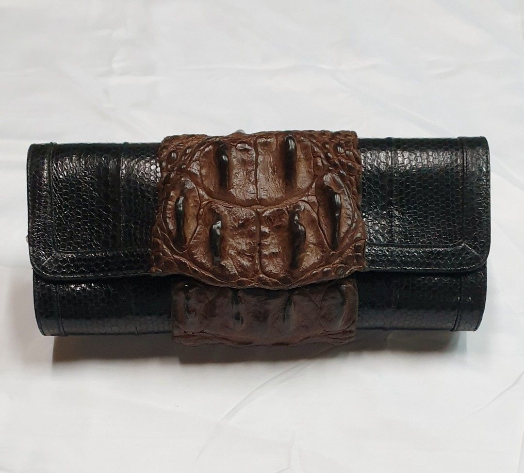 Crocodile with snake clutch (Category: Luxury Bags & Wallets) located in Quezon City. Submitted by ilovenystuff (Listing ID 1243022734, Image 1). Description: Crocodile with snakeskin clutch with silver chain.