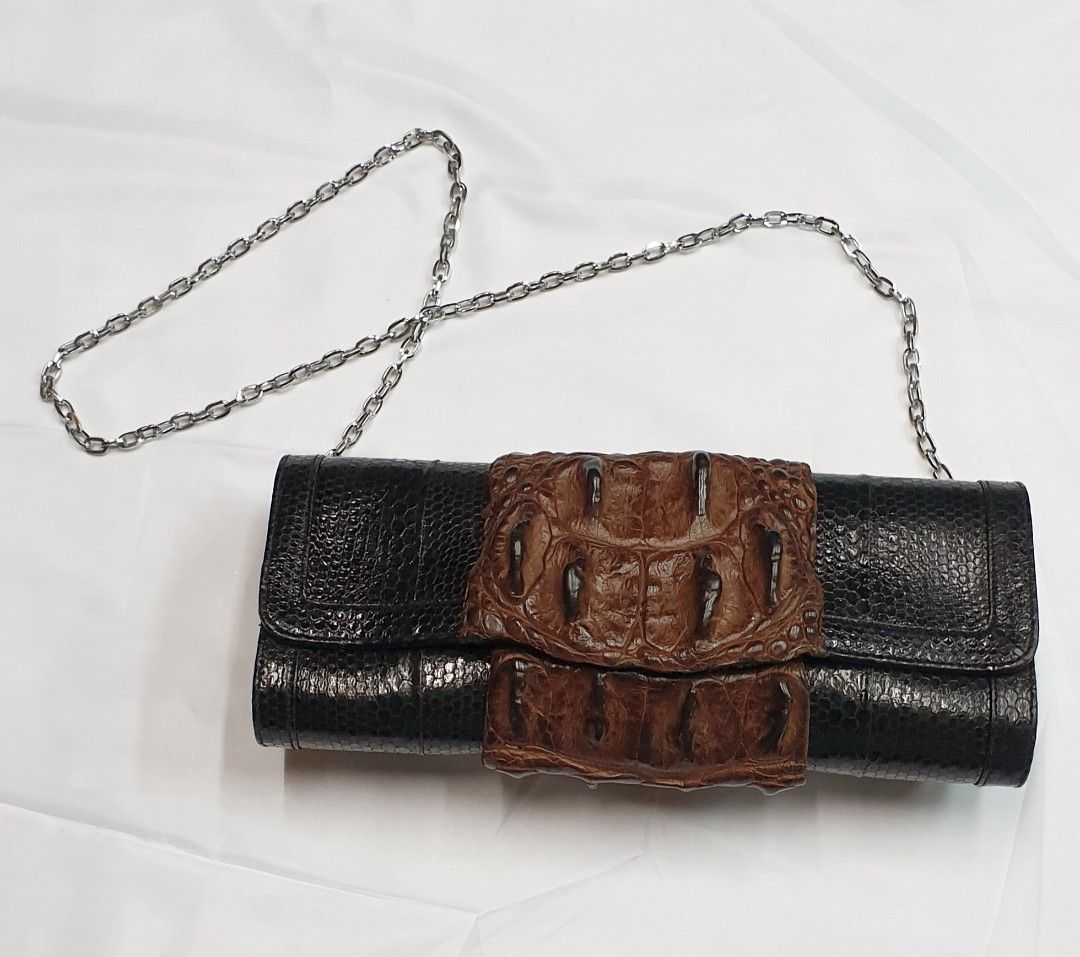 Crocodile with snake clutch (Category: Luxury Bags & Wallets) located in Quezon City. Submitted by ilovenystuff (Listing ID 1243022734, Image 3). Description: Crocodile with snakeskin clutch with silver chain.