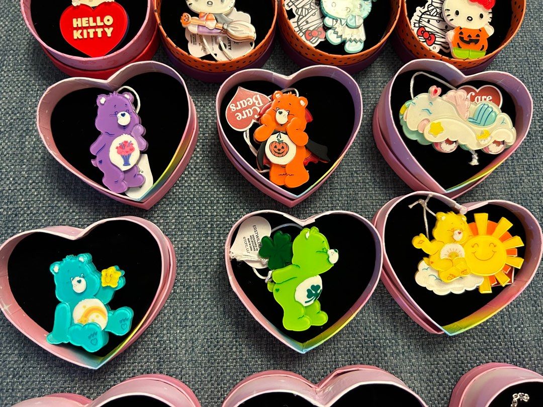 Erstwilder Care Bears Hello Kitty and assorted resin brooches and