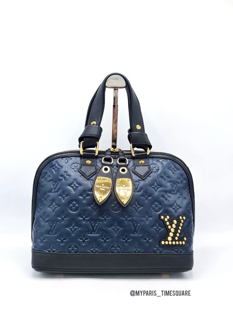 Louis Vuitton Double Jeu Leather Handbag