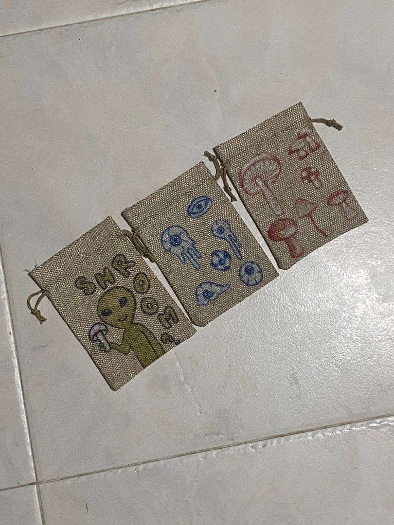 Mini Drawstring bag (Category: Belt bags, Clutches and Pouches) located in Singapore. Submitted by bobbbshop (Listing ID 1242933123, Image 1). Description: Selling all 3 together for $6. Hand drawn for popup but here are some of the leftovers. Still have the plain ones, if you'd like to customise! Just text and I'll price depending on the design..