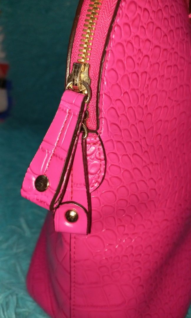 Renoma Paris Crocodile Bag (Category: Luxury Bags & Wallets) located in Iloilo. Submitted by floresse (Listing ID 1242986876, Image 3). Description: Original Renoma Paris Fuschia Pink - Crocodile Preloved item from Korea (etiketa) with sling provided by seller size: 16 inch width; 10 1/2 inch height what you see is what you get MOD: Gcash/Maya/BDO Courier: LBC - Free Shipping Payment first, before sending the item.