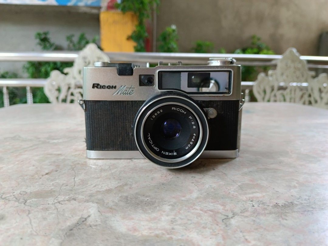 Ricoh Mate Ventage Film Camera (Category: Cameras) located in San Rafael. Submitted by edgardomabalot53 (Listing ID 1242971703, Image 1). Description: Ricoh Mate Ventage Film Camera AS. IS NO TEST ( AS IS Condition, Need to repair, for Parts or Display, Collection Purposes Only) WITH STRAP, LEN'S CAP Original Leather Case.