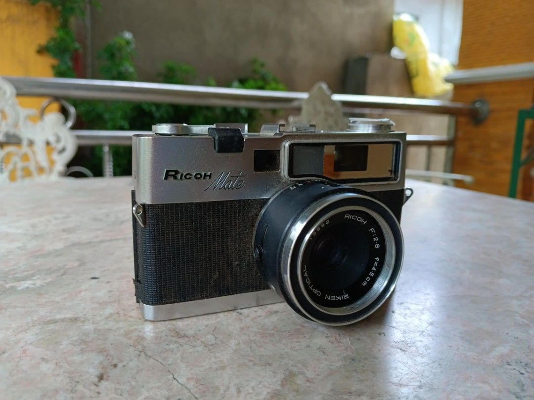Ricoh Mate Ventage Film Camera (Category: Cameras) located in San Rafael. Submitted by edgardomabalot53 (Listing ID 1242971703, Image 3). Description: Ricoh Mate Ventage Film Camera AS. IS NO TEST ( AS IS Condition, Need to repair, for Parts or Display, Collection Purposes Only) WITH STRAP, LEN'S CAP Original Leather Case.